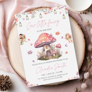 May include: A baby shower invitation with a pink and white color scheme. The invitation features a cartoon fairy and a mushroom house with the text "Our little fairy is on her way". The invitation also includes the name "Claudia Smith" and the date and time of the shower.