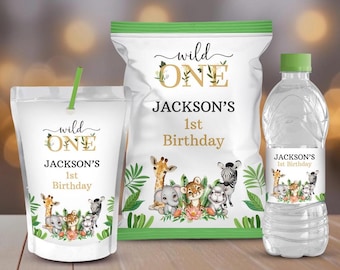 May include: A set of party favor labels featuring a jungle theme with a giraffe, zebra, elephant, and lion. The labels say "Wild One" and "Jackson's 1st Birthday".