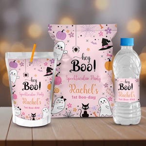 May include: A set of party favors with a Halloween theme. The items include a juice pouch with a straw, a bag of chips, and a water bottle. All items are pink and decorated with ghosts, pumpkins, and the text "hey Boo!"