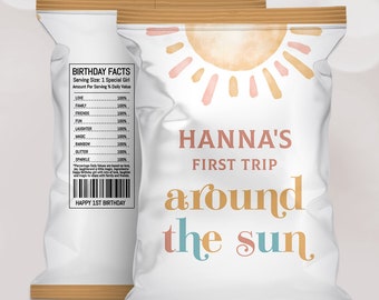 May include: Two white chip bags with a wooden top and a watercolor sun design. One bag has "HANNA'S FIRST TRIP around the sun" in pink, orange, and teal. The other bag has "BIRTHDAY FACTS" and a list of ingredients.