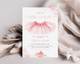 May include: A pink tutu with a pink bow on top. The text "We're tutu excited" is written in pink cursive above the tutu. The text "Join us for a baby shower honoring Stephanie Brooks" is written in black below the tutu. The date and time of the shower are listed below the name, along with the address and RSVP information. The text "Registered at Target and Amazon" is written in black at the bottom of the card.