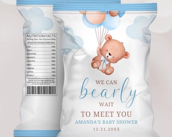 May include: Baby shower favor bags with a teddy bear holding balloons. The bags are white with blue accents and feature the text "We can bearly wait to meet you" and the baby shower date.