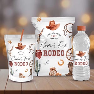 May include: Three party favor labels for a rodeo themed party. The labels are white with a brown cowboy hat, a red bandana, a horseshoe, a wagon wheel, and a dragonfly. The text on the labels reads "Carter's First Rodeo".
