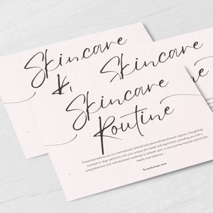 May include: A white card with black text that reads "Skincare Routine". The text is written in a handwritten style. The card is on a light wood surface.