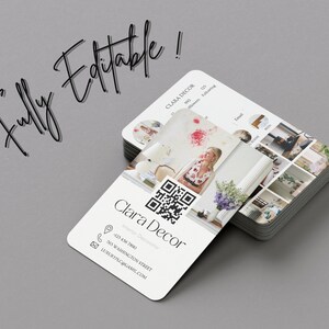 May include: A white business card with rounded corners featuring a QR code, a woman's photo, and the text "Clara Decor Interior Decorator" with contact information.
