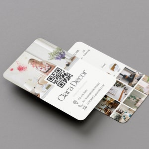 May include: A business card for Clara Decor, an interior decorator. The card features a QR code, contact information, and a collage of images showcasing interior design projects.