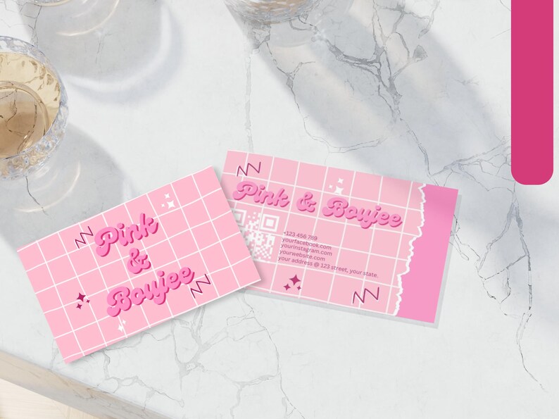 May include: Pink and Boyjee business card with a pink and white grid pattern, a QR code, and contact information. The text "Pink & Boyjee" is in a pink, retro font.