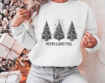 Könnte beinhalten: Weißer Pullover mit einer schwarz-weißen Grafik von drei Weihnachtsbäumen mit dem Text "Merry Christmas" darunter.
