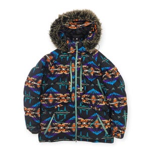 May include: A black puffer jacket featuring a vibrant geometric pattern in shades of orange, purple, and teal. The jacket includes a hood with a brown faux fur trim, a central light green zip, and long sleeves with ribbed cuffs.