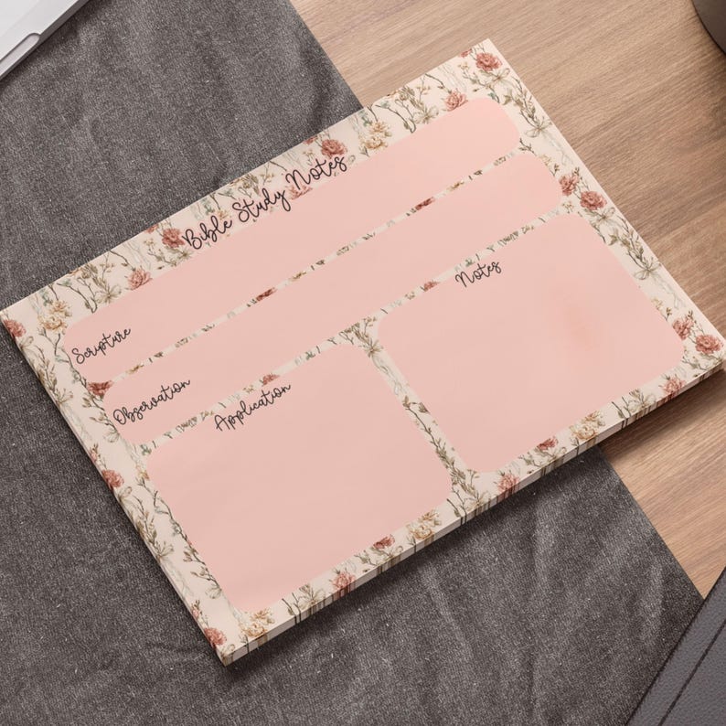 May include: A floral-patterned Bible study notes pad with a light pink interior. The pad is divided into sections labeled "Scripture," "Observation," "Application," and "Notes." The words "Bible Study Notes" are written at the top.