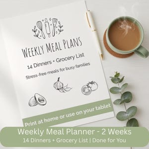 May include: A white weekly meal planner with the text "WEEKLY MEAL PLANS" and "14 Dinners + Grocery List". The planner includes illustrations of kitchen utensils, garlic, tomatoes, and an avocado. A pen and a mug of coffee are also visible.