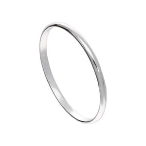 May include: A silver bangle bracelet with a smooth, polished surface. The bracelet is a simple, circular design, reflecting light. The jewelry is set against a white background.