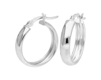 May include: A pair of silver hoop earrings. The earrings have a polished, reflective surface and a classic, rounded design. The hoops are secured with a hinged clasp.