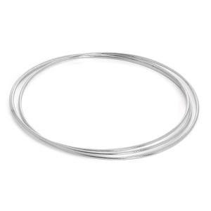 May include: A set of three silver-colored bangles. The bangles are thin, round, and smooth, with a reflective surface. They are stacked together, creating a layered effect. The jewelry is displayed against a white background.