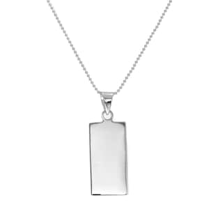 May include: A silver-colored pendant necklace. The necklace features a rectangular pendant with rounded corners suspended from a delicate ball chain. The pendant is smooth and reflective, with a polished finish.