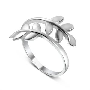 May include: A polished silver-tone ring featuring an open-ended design that wraps around the finger. The band terminates in two curved branches, each adorned with multiple smooth, rounded leaf-shaped elements extending outward in a symmetrical pattern.
