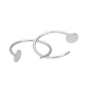 May include: Two silver-colored hoop earrings. Each earring has a curved, circular design with a small, flat, round disc at the end. The earrings are intertwined, creating a modern and minimalist aesthetic.