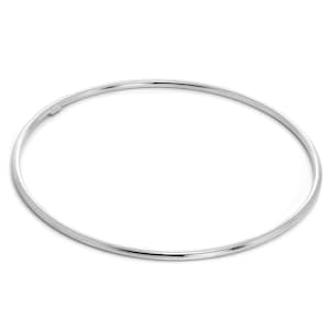 May include: A silver bangle bracelet. The bracelet is a thin, circular band with a smooth, polished surface. The bangle is made of metal. The background is white.