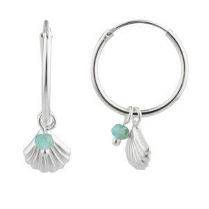 May include: Two silver hoop earrings. Each earring features a small, detailed seashell charm and a small, round, light blue bead. The earrings are designed to be lightweight and suitable for everyday wear.