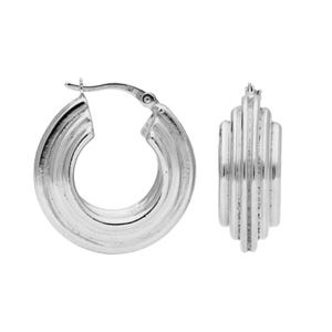 May include: Two silver hoop earrings. The earrings feature a ridged design on the outer surface. The hoops are round and have a clasp closure. The earrings are displayed against a white background.