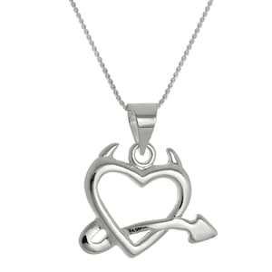 May include: A silver-colored necklace featuring a pendant with a heart shape pierced by an arrow. The heart has small horns on top, giving it a devilish appearance. The chain is a delicate, silver-colored cable chain.