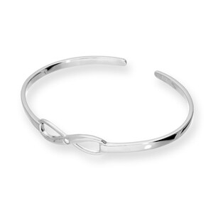 May include: A silver cuff bracelet with an infinity symbol design. The open-ended bracelet has a polished finish. The infinity symbol is in the centre of the bracelet.