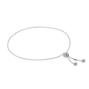 May include: A delicate silver-toned bracelet with a chain design. The bracelet features a sliding bead closure and two small decorative beads. The adjustable design allows for a comfortable fit. This piece is suitable for everyday wear.