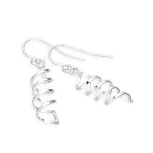 May include: A pair of silver-colored spiral earrings. Each earring features a hook for pierced ears and a coiled design that resembles a spring. The earrings are displayed against a white background.