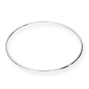 May include: A simple, silver-colored bangle bracelet. The circular bracelet is made of a thin, smooth metal and is set against a white background. The bangle is a classic jewelry piece.