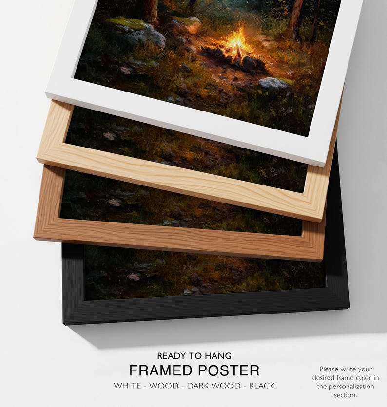 May include: Framed poster with a forest scene, available in white, wood, dark wood, and black frames. The image shows a campfire in a forest. Text at the bottom reads "READY TO HANG FRAMED POSTER" and frame color options.