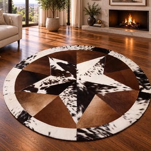 May include: A circular area rug crafted from cowhide patches in a star pattern. The design features alternating segments of solid brown, tan, and black and white spotted hide, creating a geometric star motif surrounded by a white and black border.