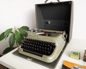 60% OFF!* Green-olive Erika Model 10 a portable working vintage typewriter from the 1950s. In awesome condition, with case, unusual gift