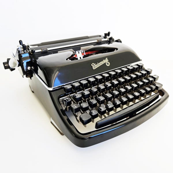 Máquina de escribir Rheinmetall KST en funcionamiento, mantenida profesionalmente, 1950, color negro