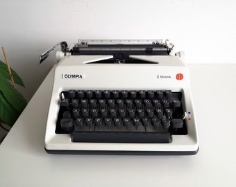 60% OFF! typewriter Olympia Monica, from the 1970's. Vintage manual typewriter in awesome working condition. Unusual gift.