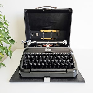 50% OFF!* Black Erika Model 10 a portable working vintage typewriter from the 1950s. Unusual gift, retro office