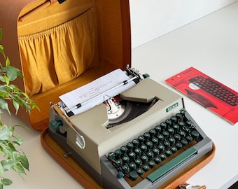Erika Model 14 - a portable working vintage typewriter from the 1960s. Like New