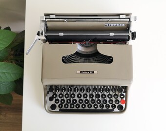 60% OFF!* Genuine Iconic Olivetti Lettera 22 a portable working vintage typewriter from the 1960s, good condition, with case.