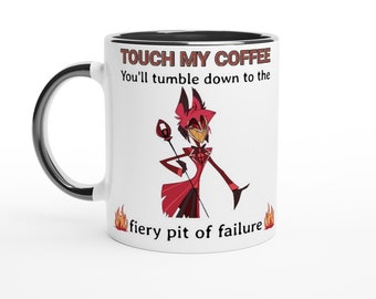 May include: White ceramic coffee mug with a black rim. The mug features a cartoon image of a red demon with horns and a pitchfork. The text on the mug reads "Touch my coffee You'll tumble down to the fiery pit of failure".