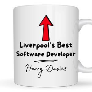 May include: White ceramic mug with a red arrow pointing up and the text "Liverpool's Best Software Developer Harry Davies".