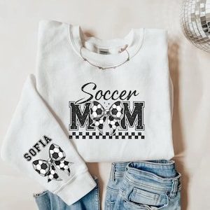 Coquette Soccer Mom Kids Name On Sleeve Sweatshirt, Mom Soccer Sweater, Soccer Mama Shirt, Gift for Soccer Mom, Fall Soccer Season Shirt