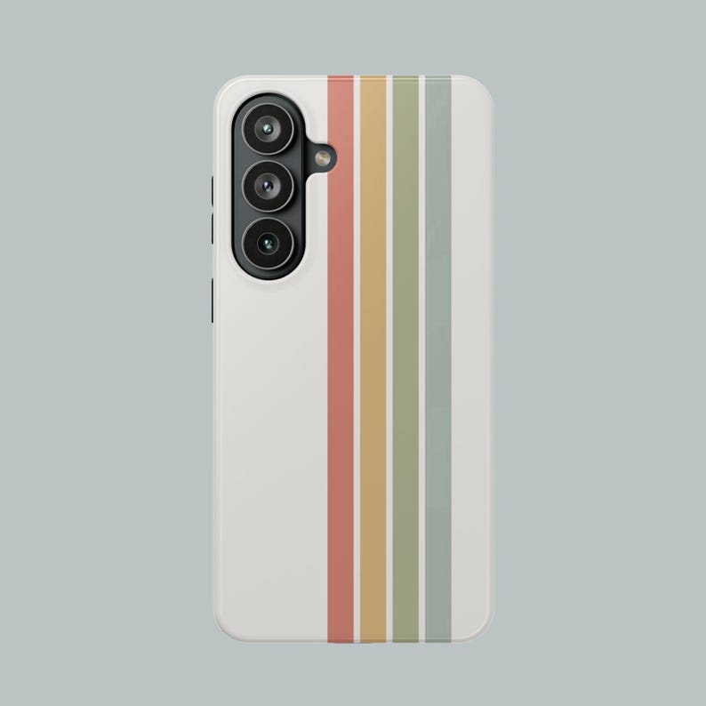 May include: A white phone case with a vertical striped design in muted colors: red, yellow, green, and gray. The phone case has a camera module with three lenses.