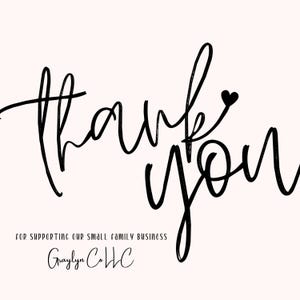 May include: Black and white handwritten text that says "thank you" with a small heart above the "u". Below the text is the phrase "for supporting our small family business" and the name "Graylyn Co LLC".