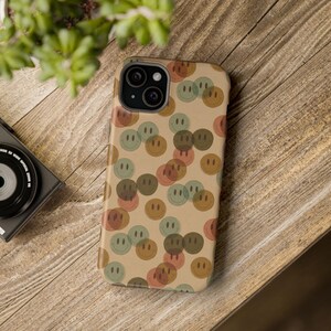 May include: A phone case Brown hues and minimalistic vibes. The case is designed for an iPhone and has a camera cutout in the top left corner.