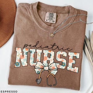 Nurse Comfort Colors® Floral Shirt, Bow Nurse Shirt, RN Shirt, Nurse Graduation Gift, Nurse Week Shirt, Nurse Appreciation, Gift For Nurse