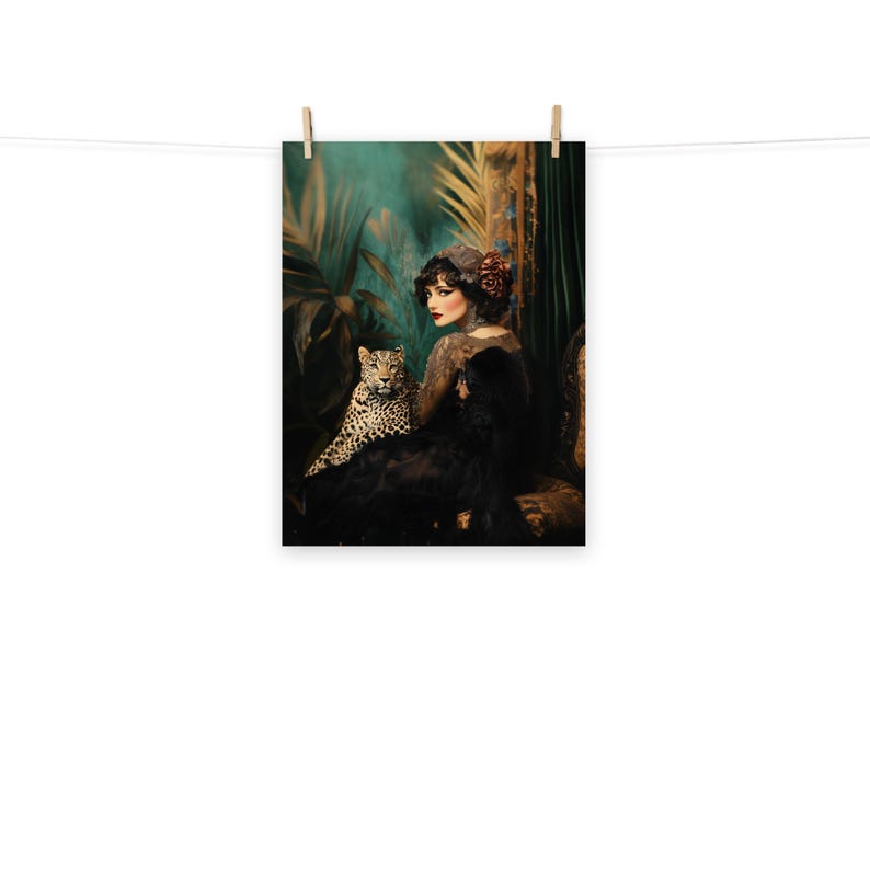 May include: A woman in a black dress with a leopard print sits in a chair with a leopard print. The woman is wearing a flower in her hair and has a dark background.