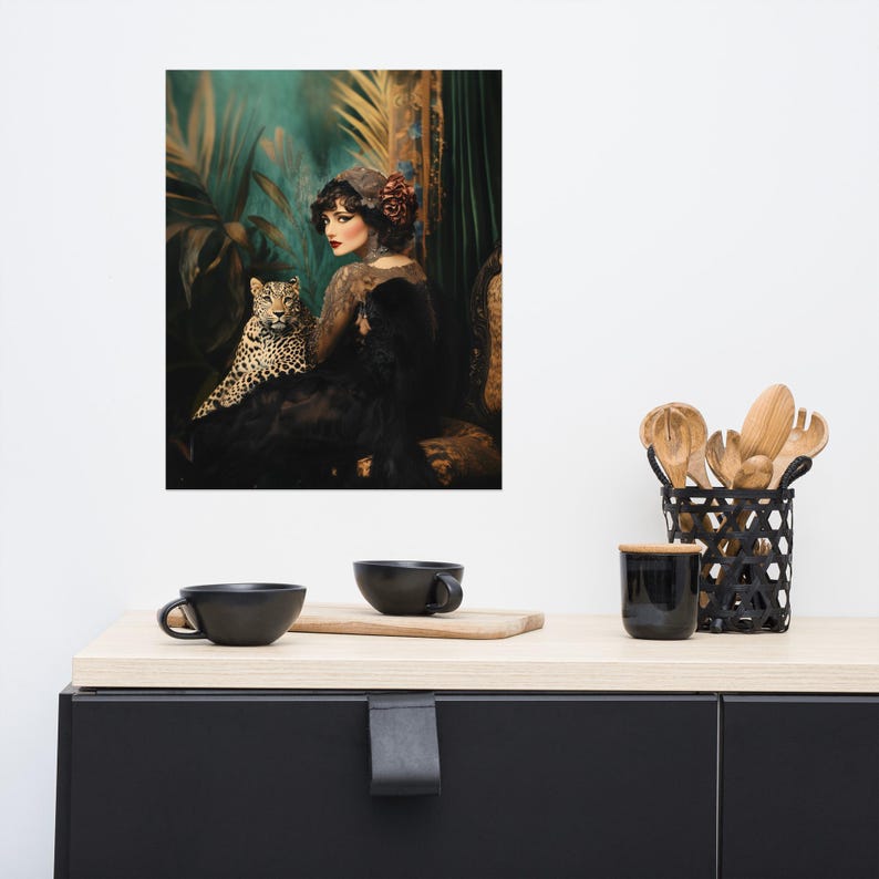 May include: A woman in a black dress and a red flower in her hair sits with a leopard in a lush green jungle setting.