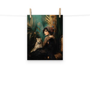 May include: A woman in a black dress and a red flower in her hair sits with a leopard in a lush green jungle setting.