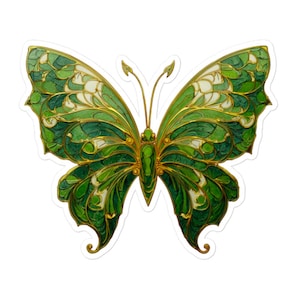 May include: A sticker featuring a detailed butterfly design. The butterfly has green and white wings with gold-colored outlines and accents. The design is symmetrical, with the butterfly's body and antennae also in gold.