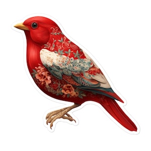 May include: A striking red bird sticker featuring detailed floral and scrollwork patterns in white, teal, and peach. The bird has a yellow beak and detailed feet, set against a clean white background. Ideal for adding a touch of nature-inspired art to any surface.