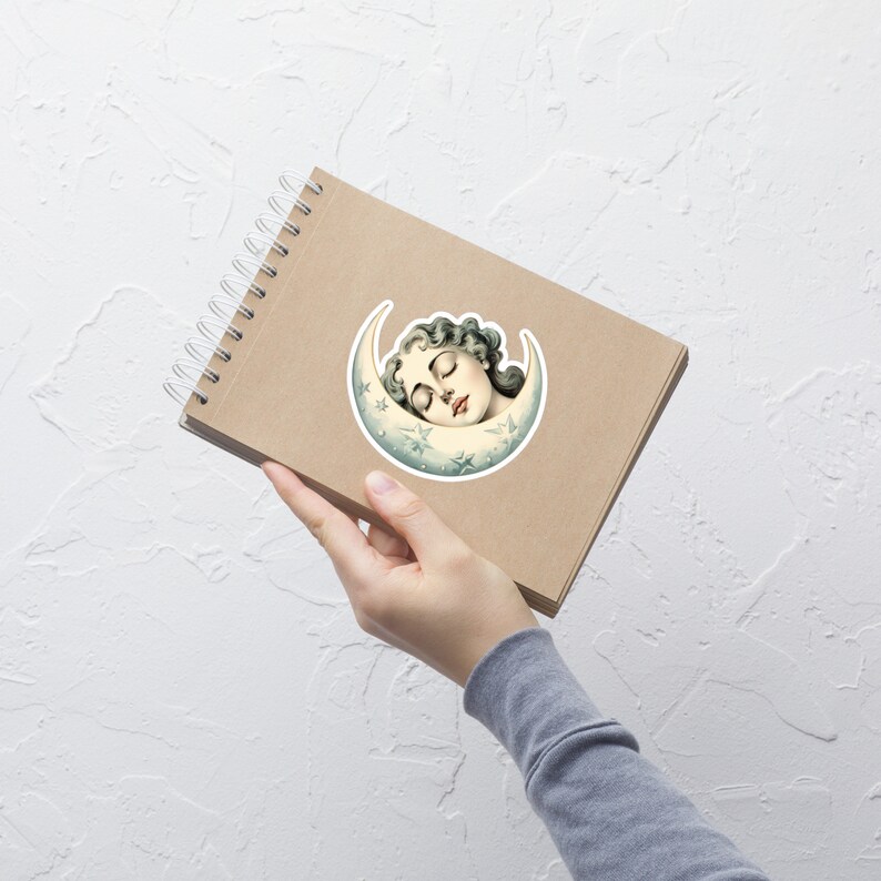 May include: A sticker featuring a vintage illustration of a woman sleeping inside a crescent moon with stars. The moon is white with a blue and green gradient.